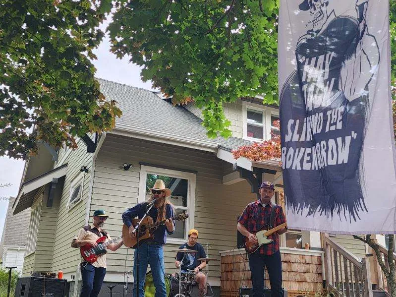 A band performing on a porch at Tacoma Porchfest