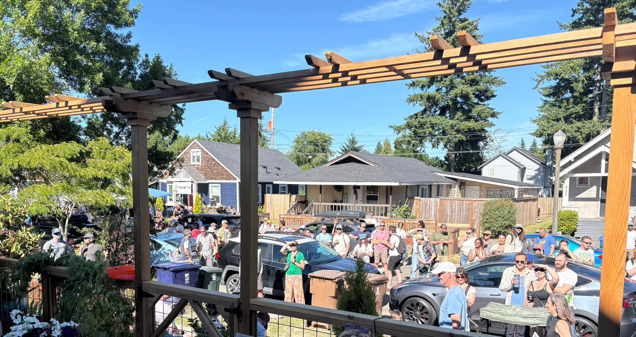 A crowd gathered for a backyard performance at Tacoma Porchfest